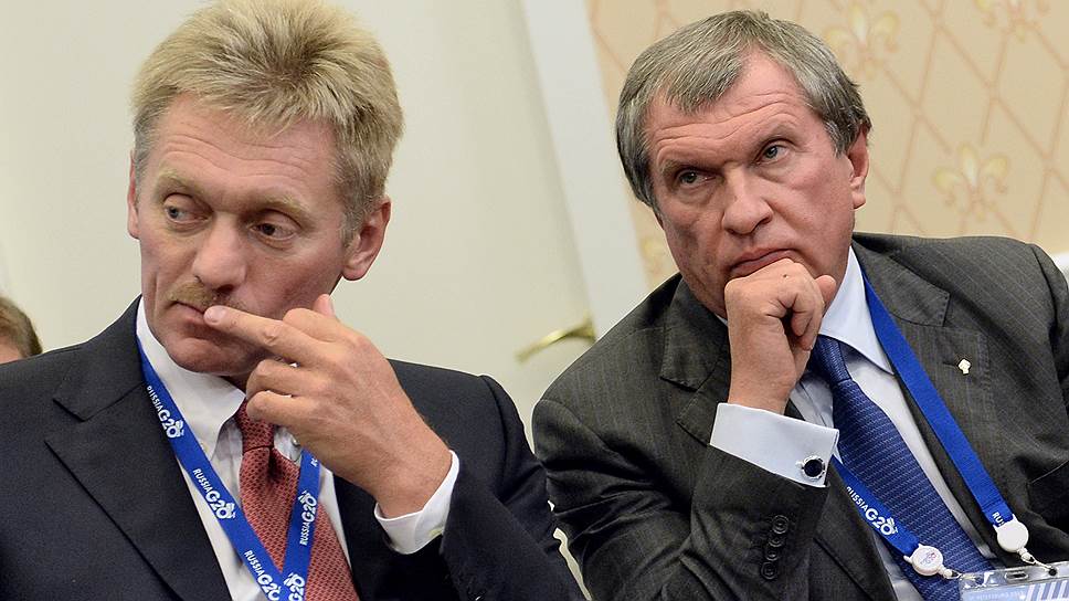 Пресс-секретарь президента Дмитрий Песков (слева) и президент, председатель правления ОАО «НК "Роснефть» Игорь Сечин 