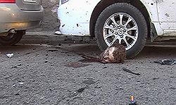 Последствия взрыва террориста-смертника возле Ленинского районного отдела внутренних дел