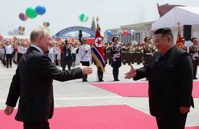 Владимир Путин (слева) и Ким Чен Ын