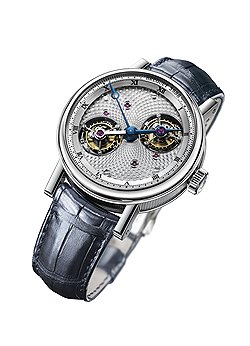 Breguet, Classique Grande Complication Double Tourbillon: сверхсложные часы с корпусом из платины диаметром 44 мм. Циферблат из посеребренного золота с выступающим внутренним ободком. Часовая шкала с римскими цифрами, часовая стрелка является продолжением моста, на котором закреплены две каретки турбийона. Гравированная вручную центральная пластина с двумя отверстиями для турбийонов совершает один оборот вокруг своей оси за 12 часов. Механизм с ручным подзаводом, задняя сторона механизма украшена выгравированным вручную рисунком Солнечной системы