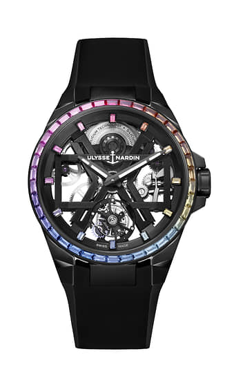 Ulysse Nardin Blast Rainbow. Титановый корпус 45 мм из стали с черным DLC-покрытием. На кольце циферблата драгоценные камни, подобранные по цвету радуги. Механизм с кремниевыми деталями спуска UN-172, автоподзаводом и запасом хода 72 часа. «Парящий» турбийон, микроротор из платины на «12 часах». Ограниченная серия 50 экземпляров 